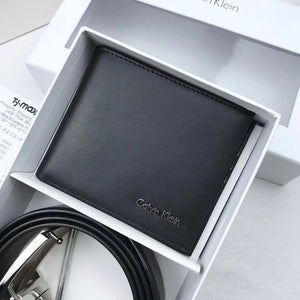 Black Calvin Klein wallet in a branded box on a light gray surface