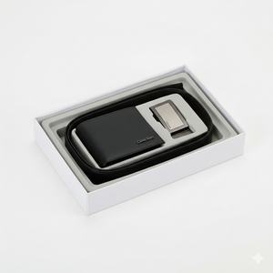 Top view of Calvin Klein black smooth leather wallet and belt set highlighting the sleek silver metal buckle and minimalist corner logo plaque