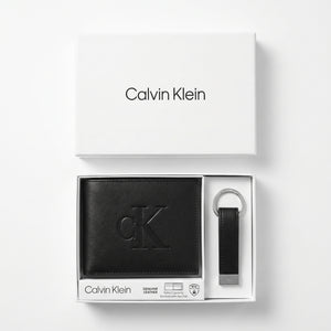 Macro close-up photograph showing the premium smooth leather texture and precision embossed ck logo on the wallet