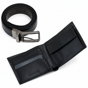 Interior view of an open Calvin Klein black leather wallet showing multiple card slots and a coin pocket, paired with a matching reversible leather belt