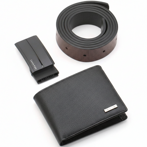Top-down view of Calvin Klein black gift set highlighting the textured pebble leather wallet with metal logo and sleek matte black belt buckle