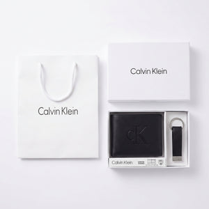 Full presentation of the Calvin Klein mirror original leather wallet and key fob gift set with signature white box and shopping bag