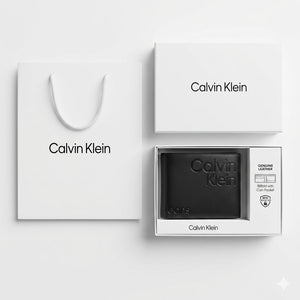 Full premium packaging presentation of the Calvin Klein Jeans mirror original smooth black leather bifold wallet with its white gift box and matching shopping bag