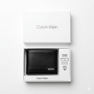 Top-down studio product photography of the Calvin Klein smooth black leather wallet resting inside its open premium white gift box