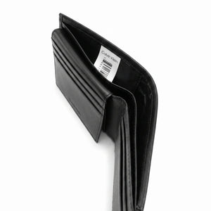 Black wallet with Calvin Klein label on a white background