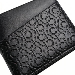 Professional angled studio photograph of the sleek Calvin Klein mirror original black leather wallet showcasing the geometric front panels and small silver logo plate