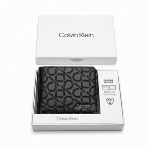 Top-down studio product photography of the Calvin Klein mirror original smooth black leather wallet and card case set neatly resting inside its open custom white branded gift box