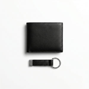 Straight studio layout view of the Calvin Klein mirror original black leather wallet back panel next to its standalone matching leather key ring