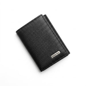 Black leather wallet with Calvin Klein logo on a white background