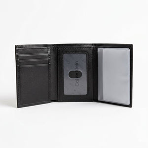 Live smartphone photograph of the opened Calvin Klein mirror original leather trifold wallet showcasing the internal layout, clear ID window, and transparent card booklet slots