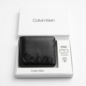 Top-down studio product photography of the Calvin Klein mirror original smooth black leather wallet neatly resting inside its open custom white branded gift box