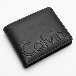 High-angle interior view of the opened Calvin Klein leather wallet currency compartment highlighting the original white tracking barcode label and grey lining
