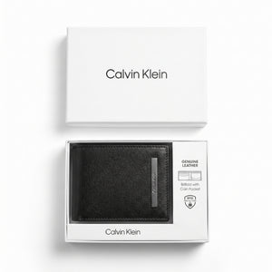 Top-down studio product photography of the Calvin Klein mirror original textured black leather wallet neatly resting inside its open white branded gift box