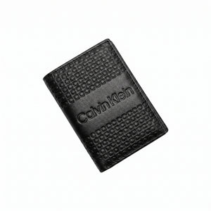 Professional angled studio photograph of the sleek Calvin Klein mirror original monogram bi-fold leather wallet