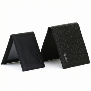 Interior detail of card pockets and logo in Calvin Klein black leather wallet
