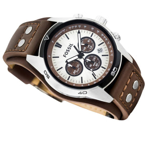 Angled real-life photo of Fossil CH2565 showing the industrial case and leather texture with rivets