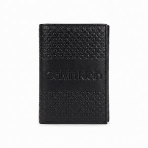 Macro close-up view showing the high-quality genuine leather texture and precision embossed ck monogram on the wallet