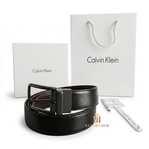 Professional standing view of the Calvin Klein mirror original reversible leather belt featuring the classic matte black buckle