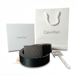 Professional standing view of the Calvin Klein mirror original reversible leather belt featuring the matte textured buckle