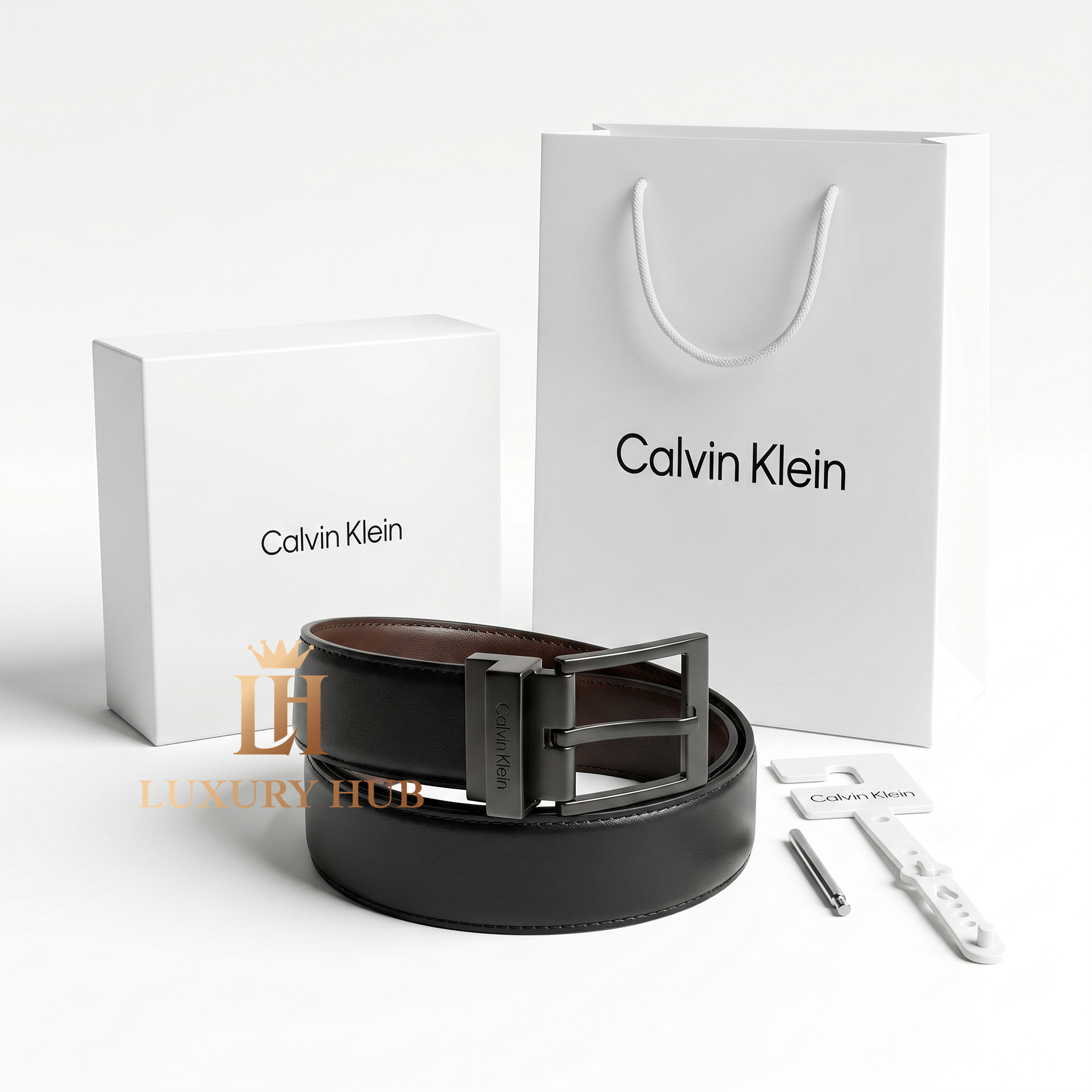Top view product photography of Calvin Klein reversible leather belt presented with its signature white gift box
