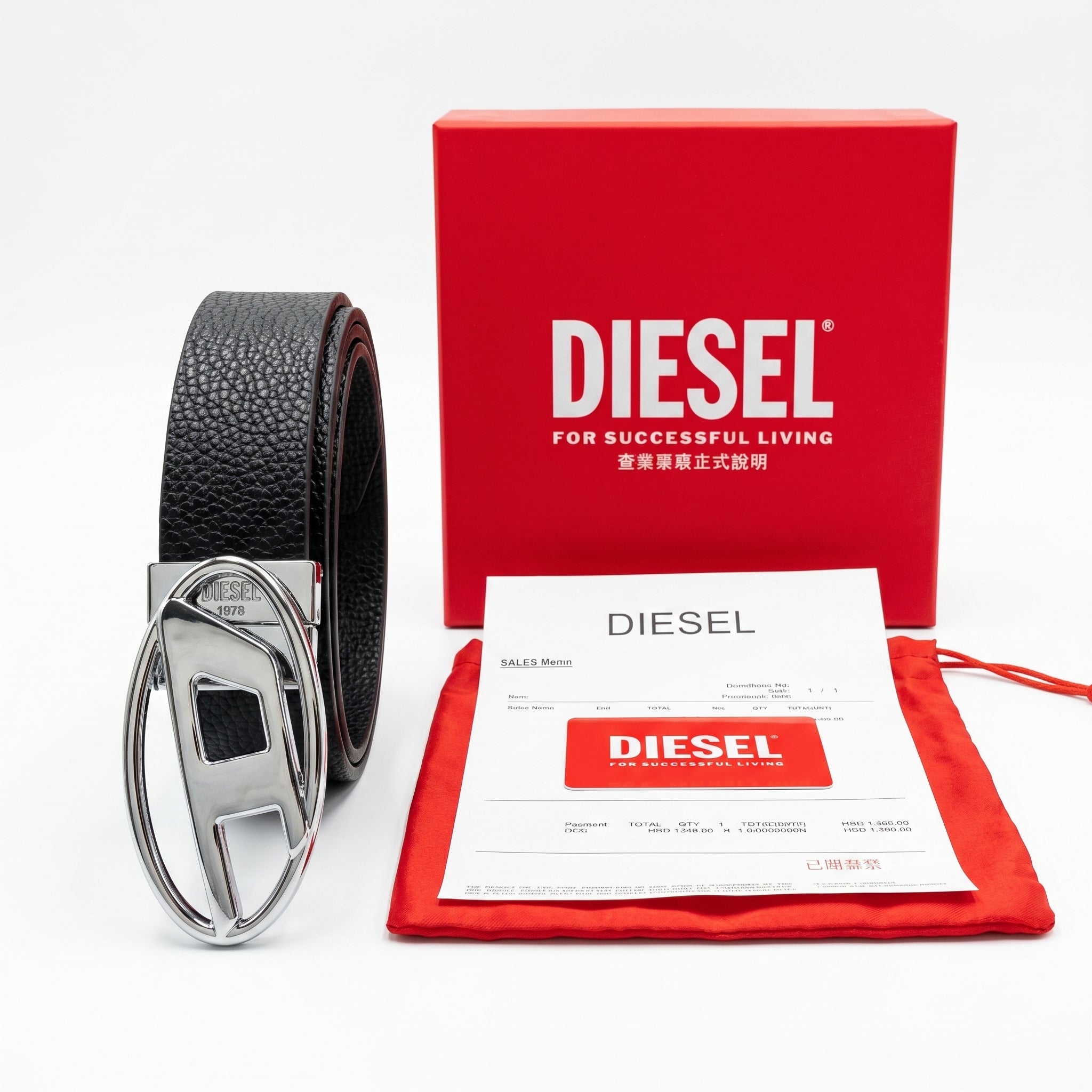 Full premium packaging presentation of the Diesel mirror original pebbled black leather belt alongside its red gift box, matching dust bag, branded card, and store receipt with silver buckle