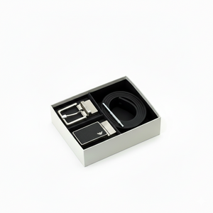Emporio Armani men's luxury gift set featuring a black textured leather belt and two interchangeable silver metal buckles inside a premium branded presentation box