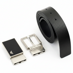 Perspective view of an Emporio Armani men's black textured leather belt set with its two stylish interchangeable metal buckles on a clean white background