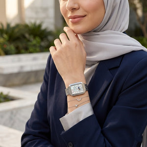 Lifestyle photo of Fossil Raquel ES5400 showing the rectangular silver watch on a woman's wrist