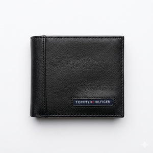 Straight front view product photography of the Calvin Klein black leather wallet showcasing the all-over embossed ck monogram pattern and center logo