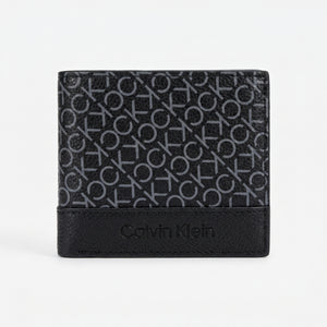 Straight front view product photography of the Calvin Klein black leather trifold wallet showcasing smooth finish and polished silver angled metal bar logo