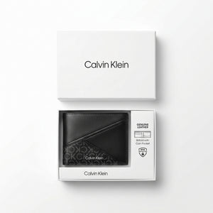 Top-down studio photograph of the Calvin Klein smooth leather bifold wallet neatly placed inside its open premium black gift box