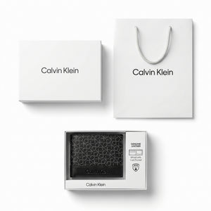 Full premium presentation of the Calvin Klein mirror original smooth black leather trifold wallet set with its white gift box and shopping bag