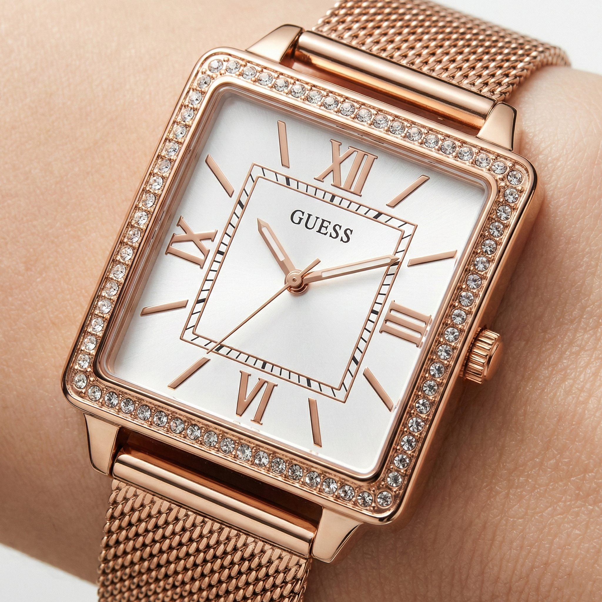 Close up shot of Guess Chelsea W0826L3 watch on wrist showing the elegant square dial and crystals
