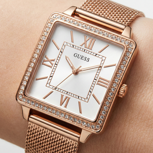 Close up shot of Guess Chelsea W0826L3 watch on wrist showing the elegant square dial and crystals