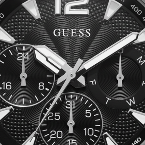 Authentic real-life photo of the Guess Commander GW0056G1 watch showing actual silver shine and black dial