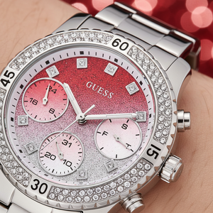 Close up shot of Guess Confetti W0774L7 watch on wrist showing the sparkling gradient dial and sub-dials