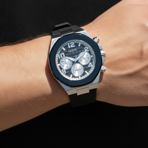 Close up shot of Guess Empire GW0583G1 watch on wrist showing the textured black dial and silver sub-dials
