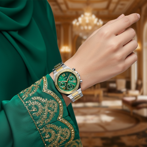 Close up shot of Guess GW0769L4 watch on wrist highlighting the green dial and coin-edge bezel