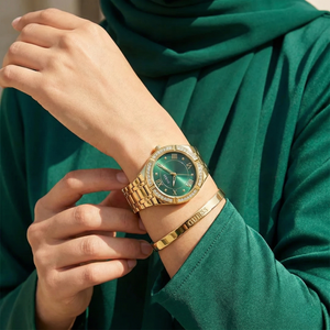 AI lifestyle shot of a woman wearing Guess Cosmo GW0033L8 gold and green watch