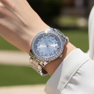 Close up shot of Guess GW0111L1 on wrist showing the silver sunray dial and baguette crystal markers