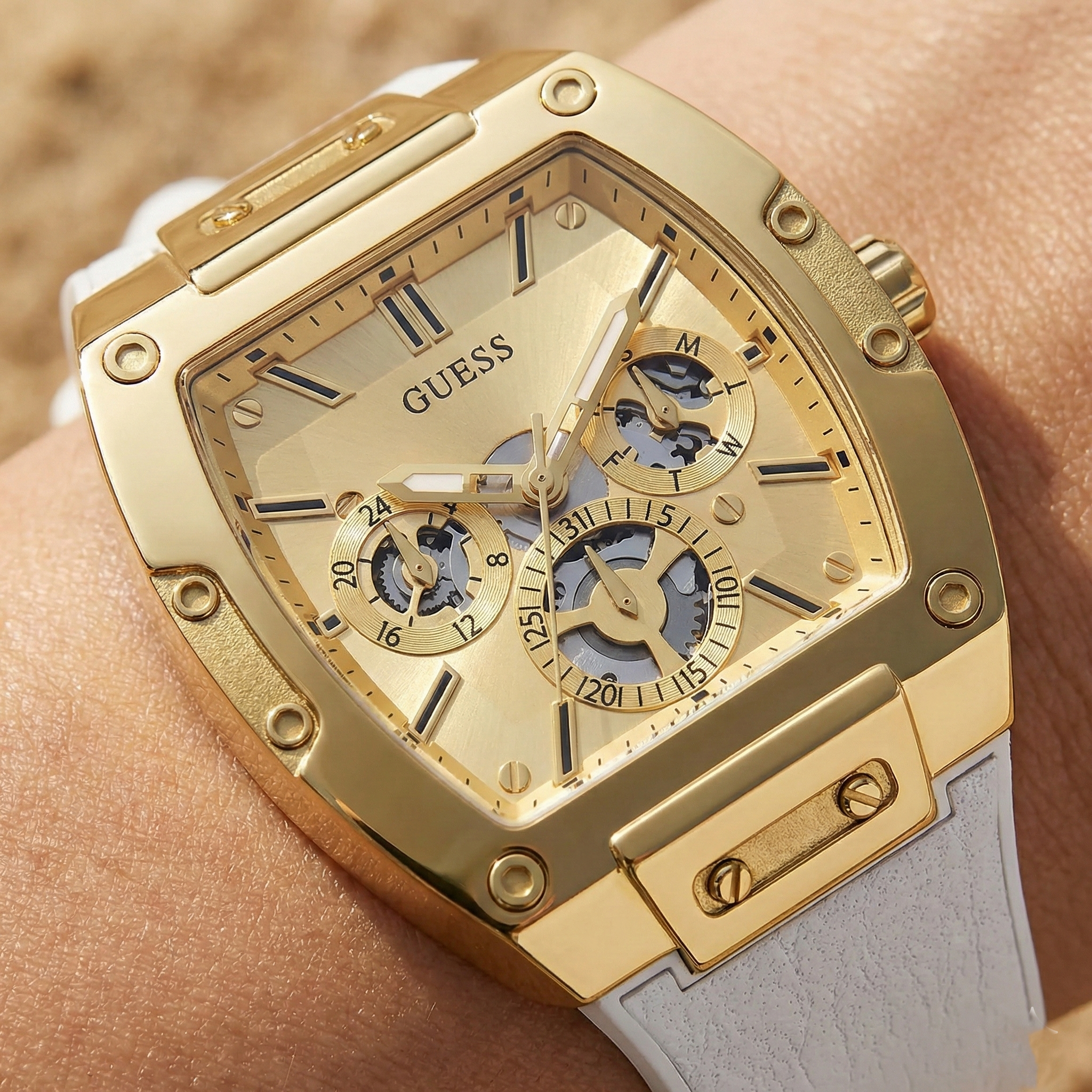 Detailed close-up of the gold-tone multifunction dial of Guess Phoenix GW0202G6