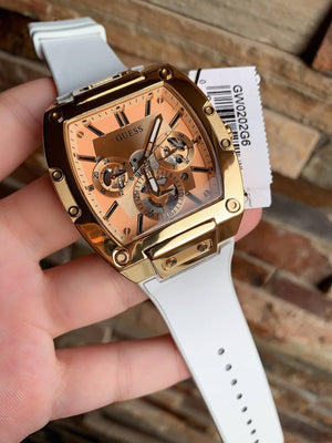Real-life photo of Guess GW0202G6 showing actual gold shine and white strap contrast