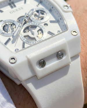 Close up shot of Guess GW0203G2 on wrist highlighting the white skeleton dial and visible gears
