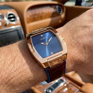 Close-up of Guess Phoenix GW0386G2 showing the blue sunray dial and diamond accent