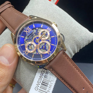 Authentic real-life photo of the Guess GW0389G3 showing actual rose gold shine and blue skeleton details in Egypt