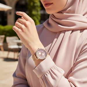 Female model wearing Guess GW0402L3 rose gold watch with a formal evening dress