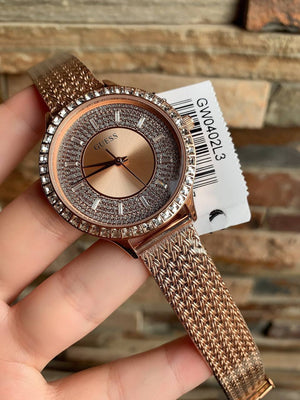 Authentic real-life photo of the Guess GW0402L3 showing actual rose gold mesh texture and crystal shine in Egypt