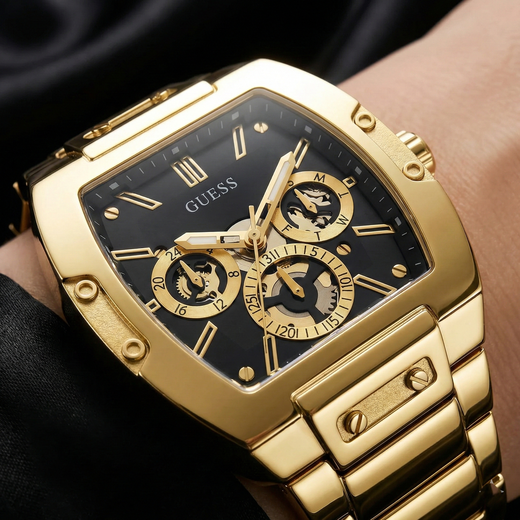 Detailed close-up of the black multifunction dial and gold hands on Guess GW0456G1
