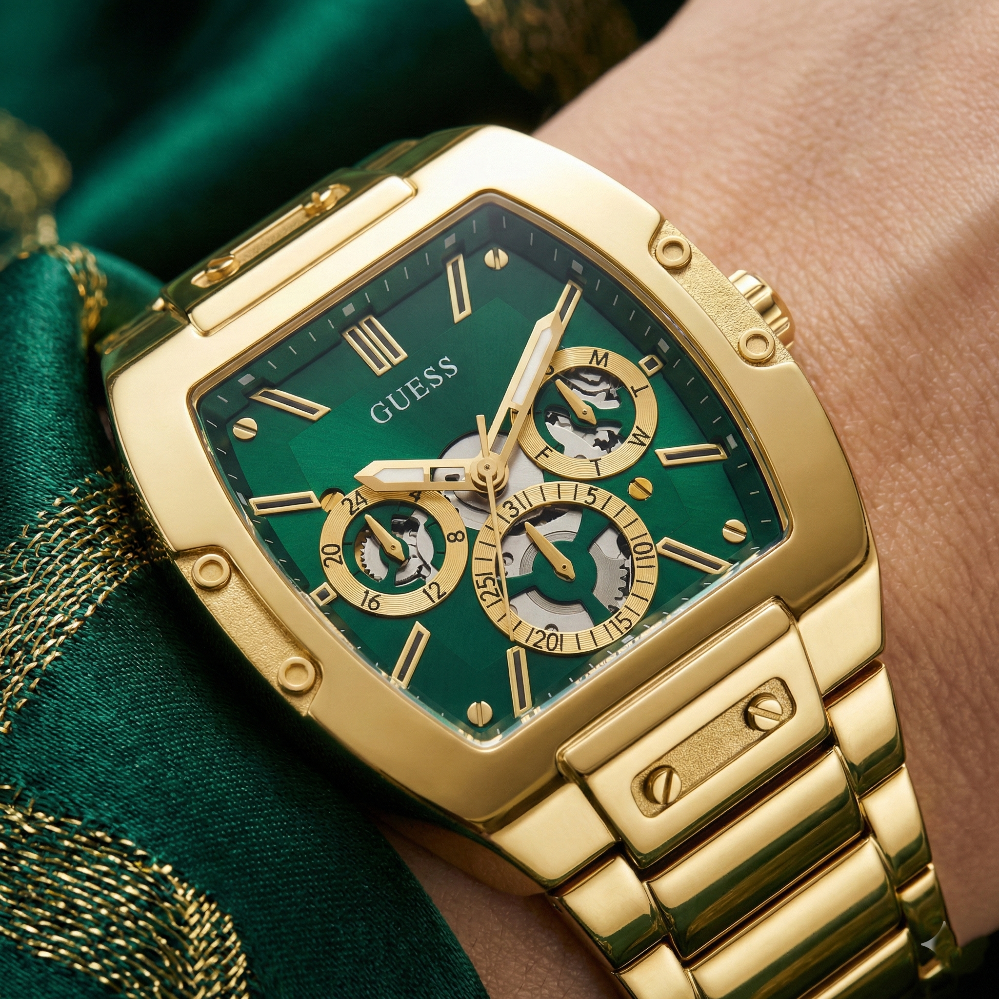Detailed close-up of the green multifunction dial and gold hands on Guess GW0456G3