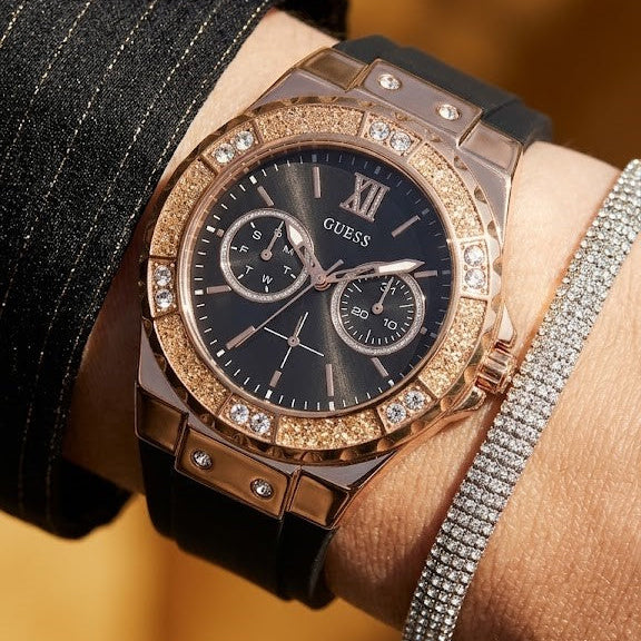 Close up shot of Guess GW0519L4 on wrist showing the black dial with multi-function sub-dials and rose gold crystal bezel details